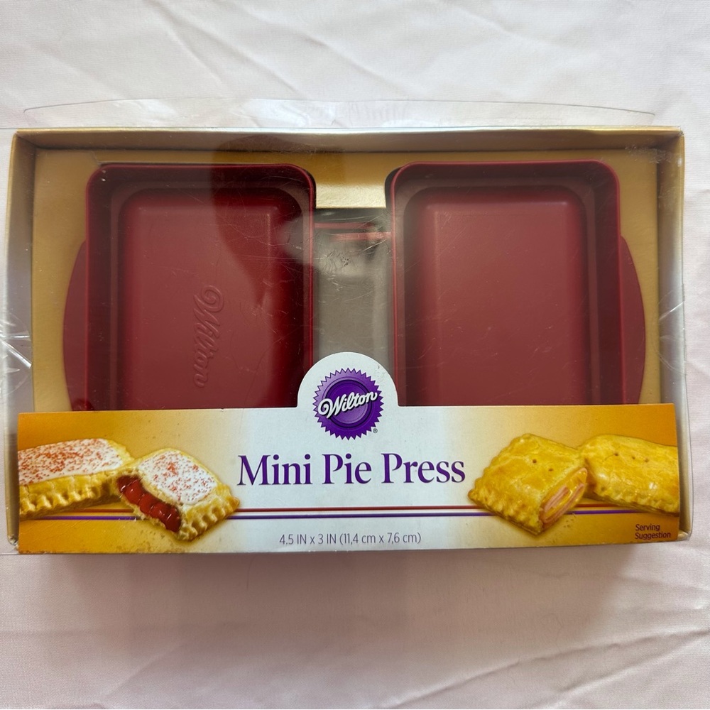 Set of 2 unopened Wilton red mini pie press
